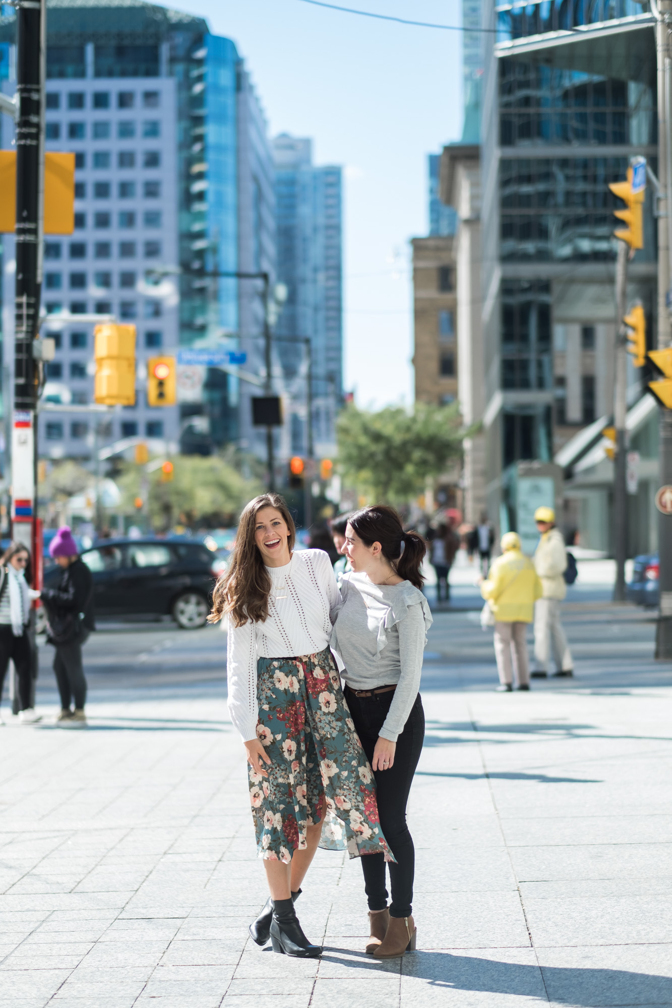 Wild Rosebuds in a floral skirt and white sweater with Keisha of Loving littles blog