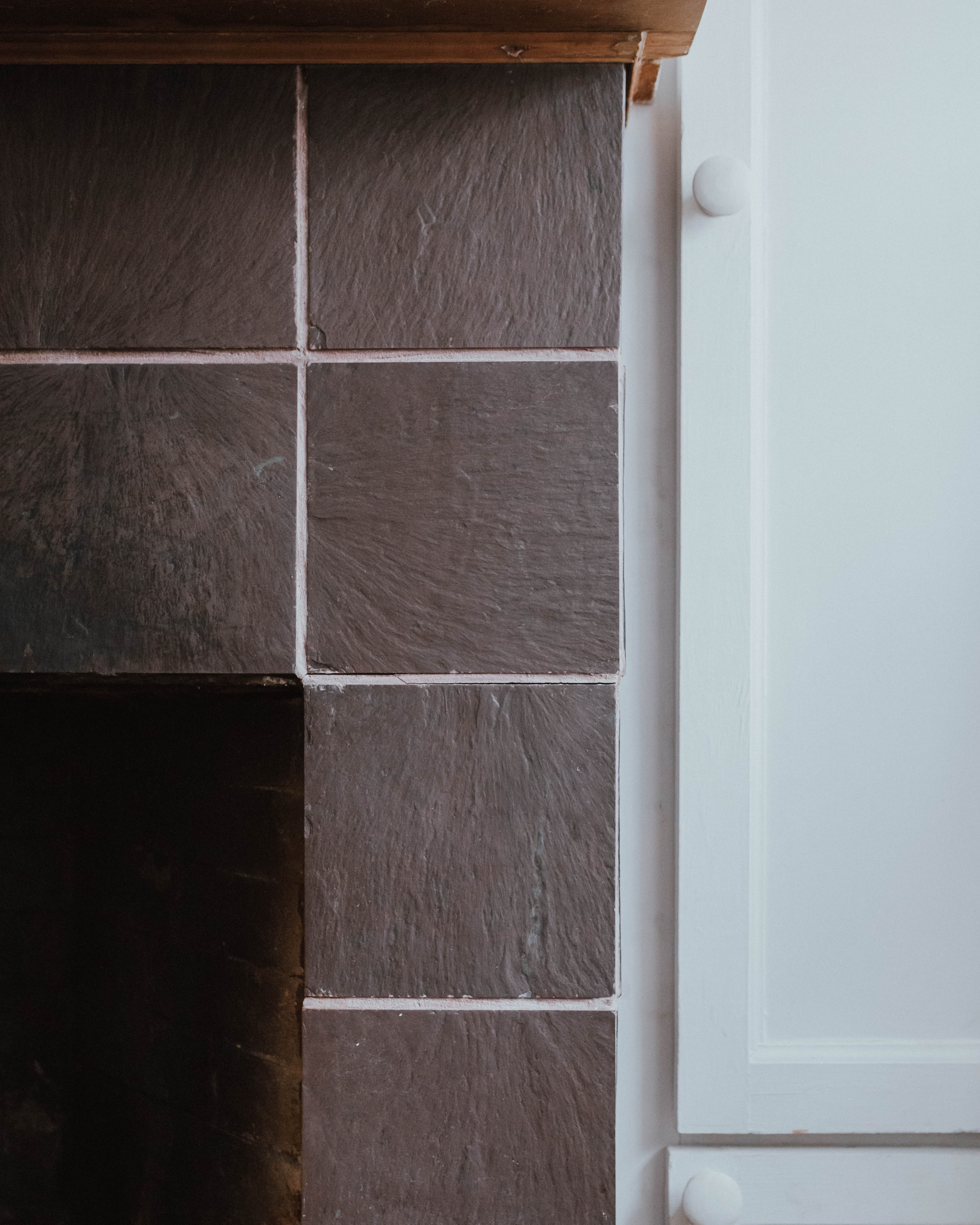 My $100 Fireplace Makeover with Behr Paint | The Wild Decoelis | tired, dirty tile