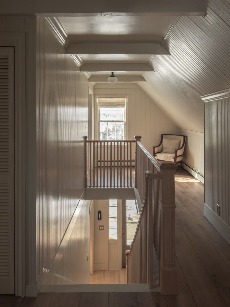 beadboard and beamed hallway