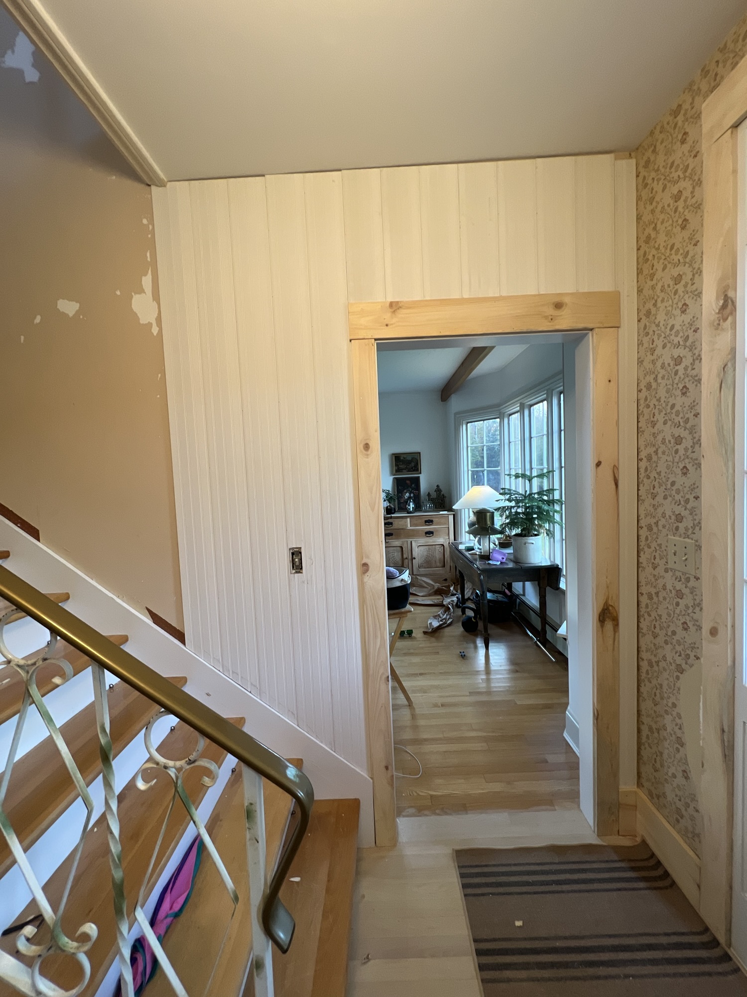 beadboard and beamed hallway