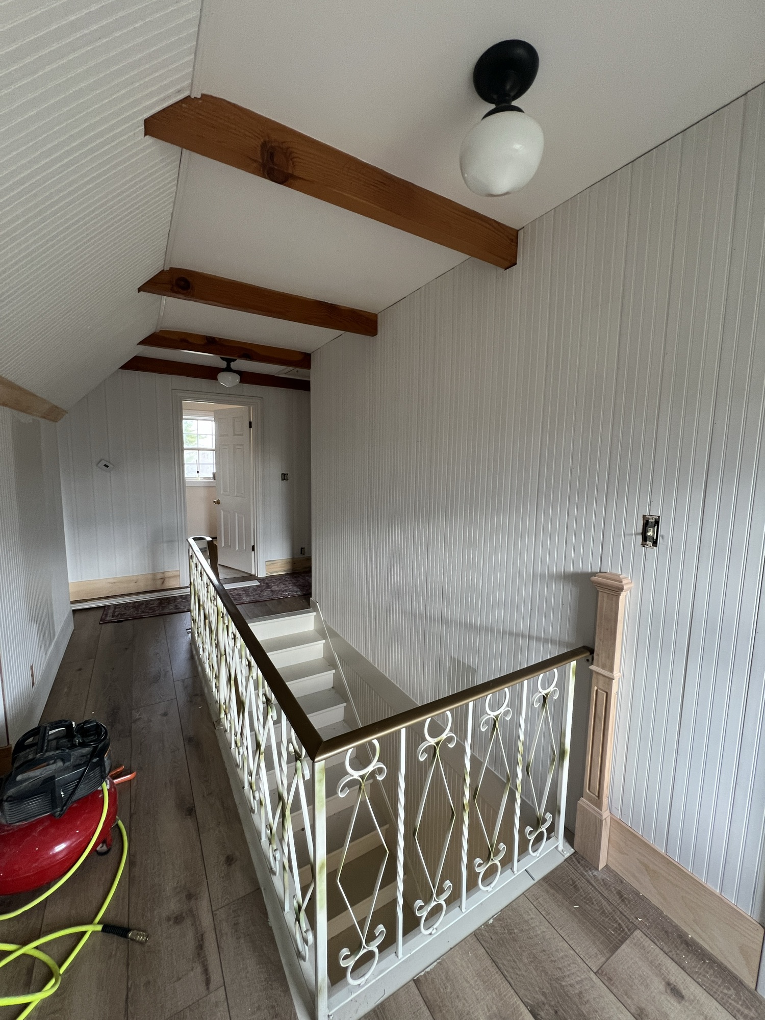 beadboard and beamed hallway