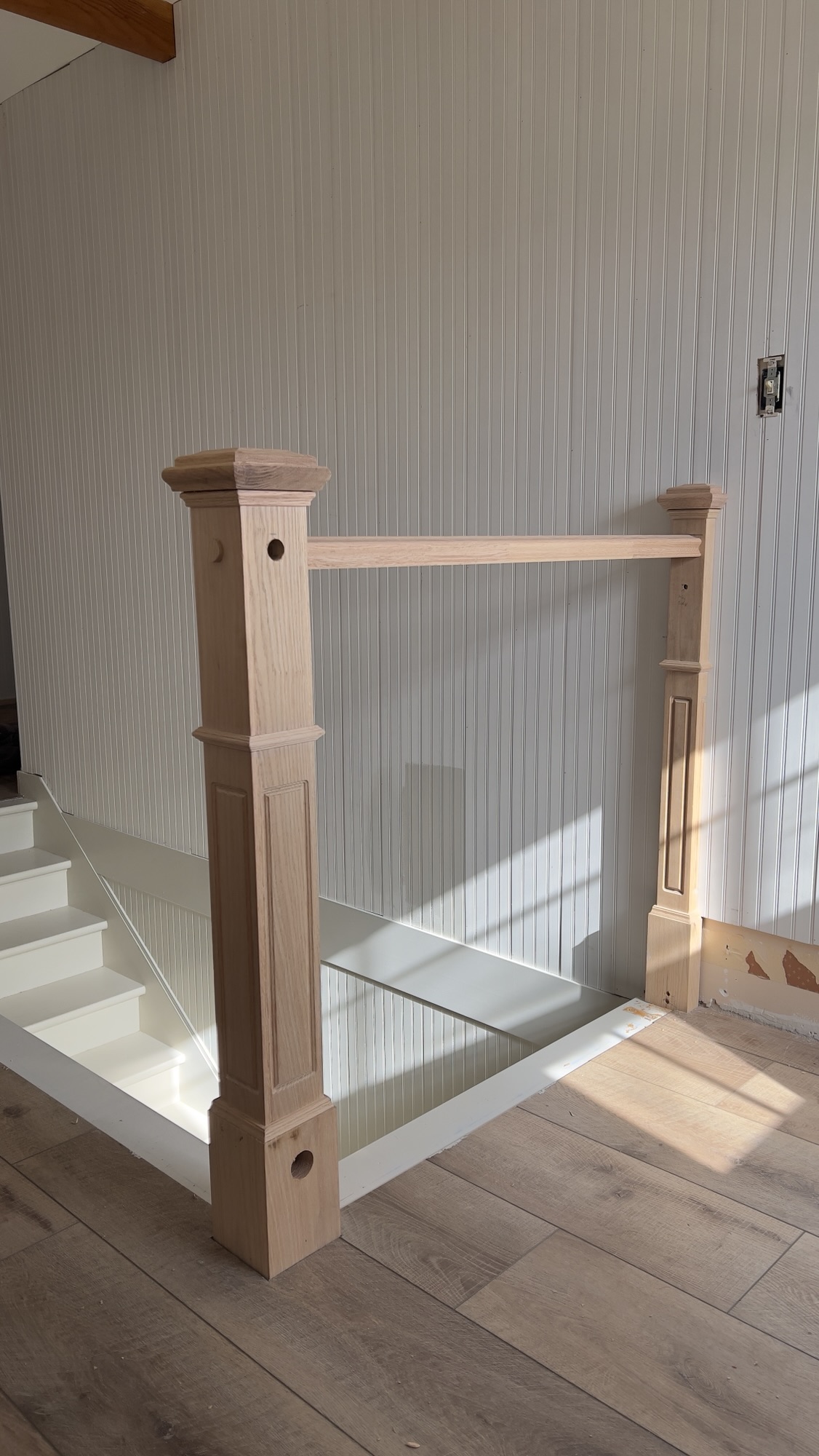beadboard and beamed hallway